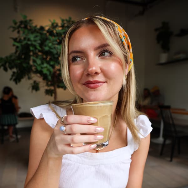 Lauren with a drink from ā Café